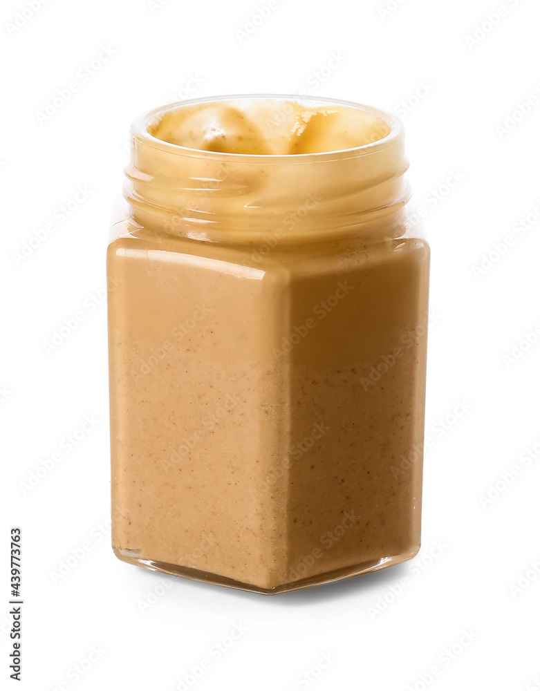 Jar with tasty peanut butter on white background