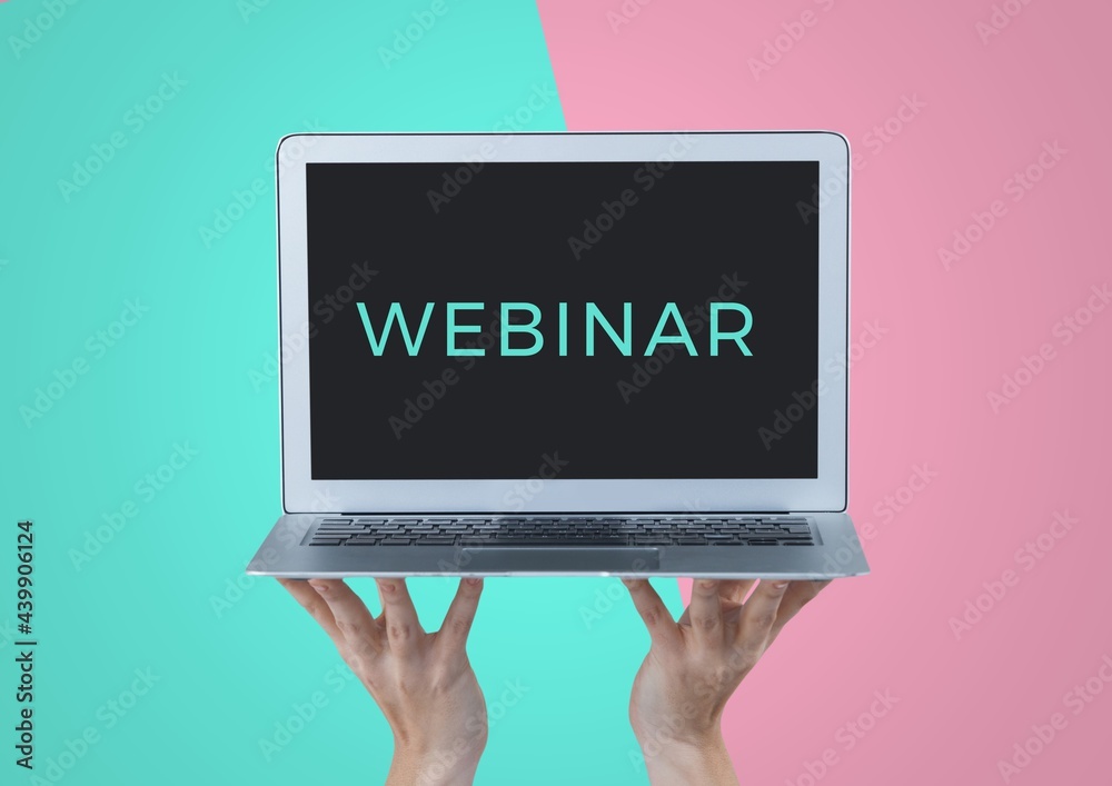 Composition of webinar text on screen of laptop held by hands, on turquoise and pink background