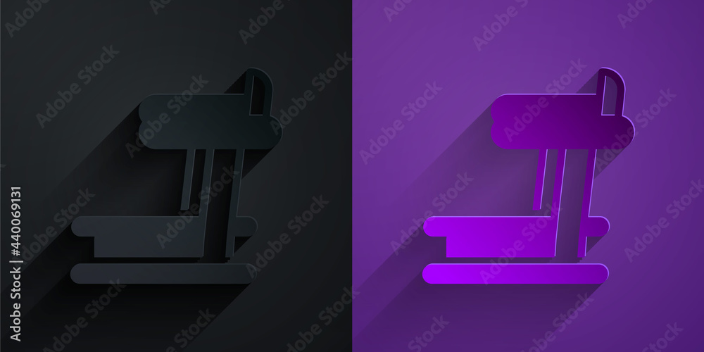 Paper cut Treadmill machine icon isolated on black on purple background. Paper art style. Vector