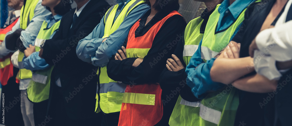 Large group of factory worker standing together in warehouse or storehouse . Logistics , supply chai