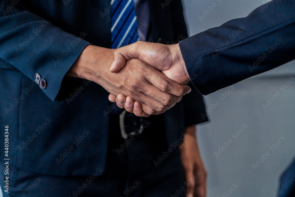 Business people agreement concept. Businessman do handshake with another businessman in the office m