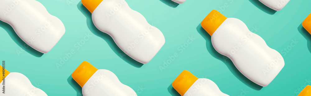 Yellow and white sunblock bottles