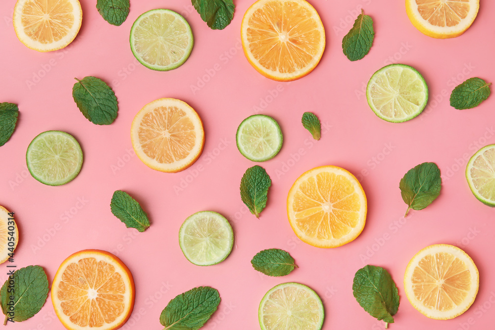 Healthy citrus fruits and mint on color background