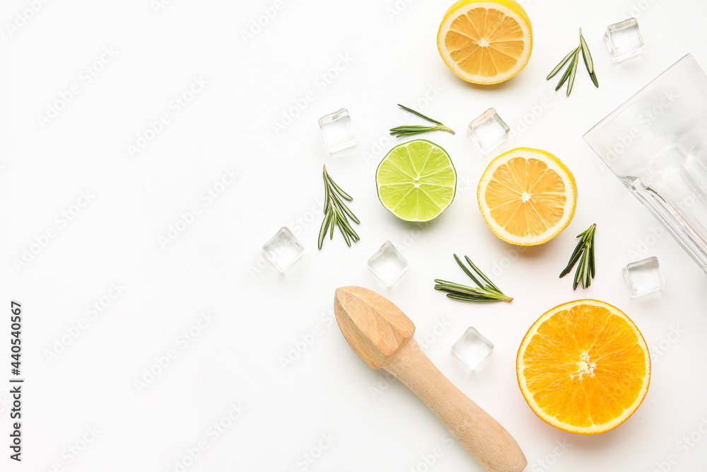 Composition with glass and healthy citrus fruits on white background