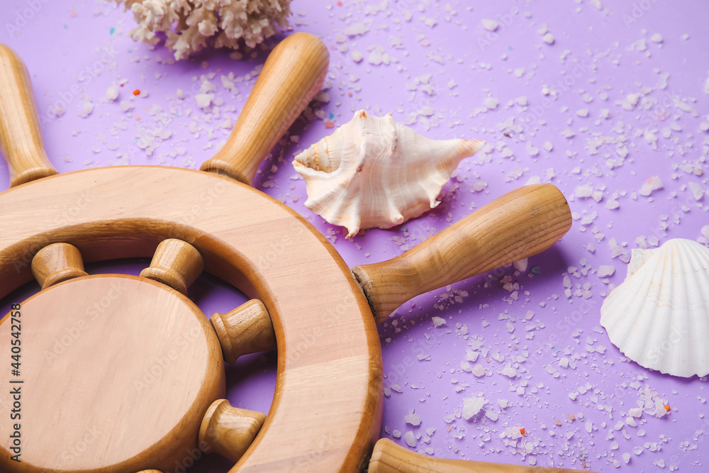 Helm and sea shells on color background