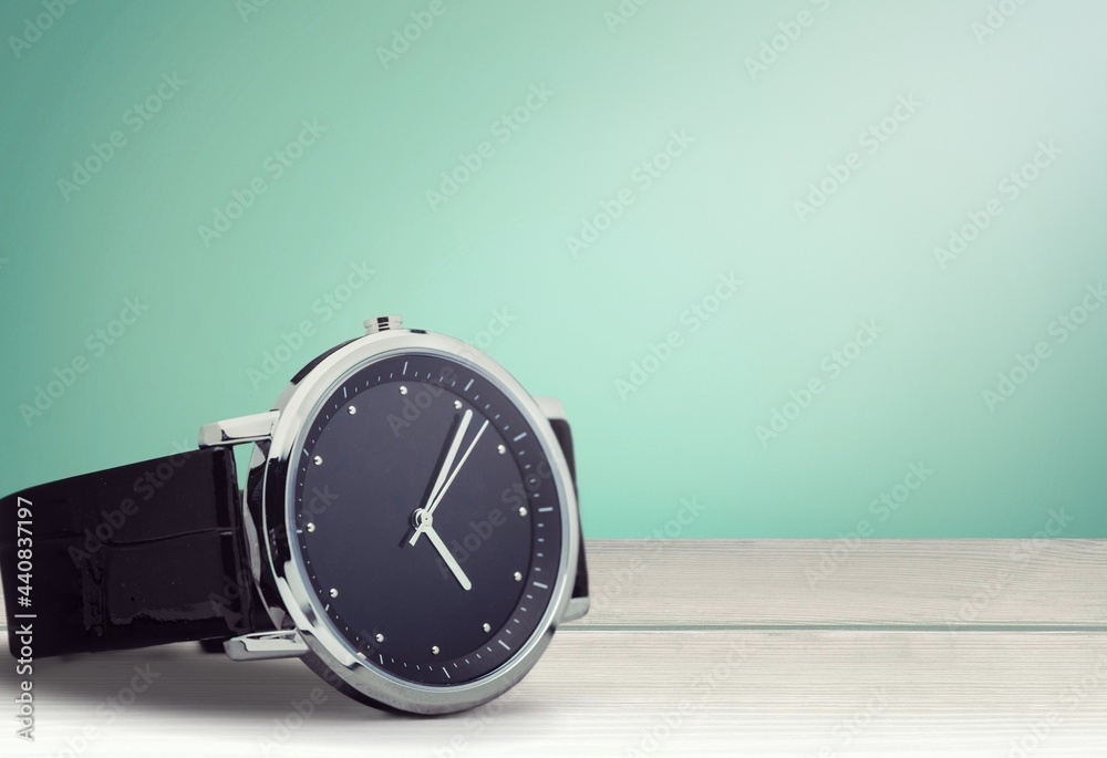 The vintage wristwatch model black on a background