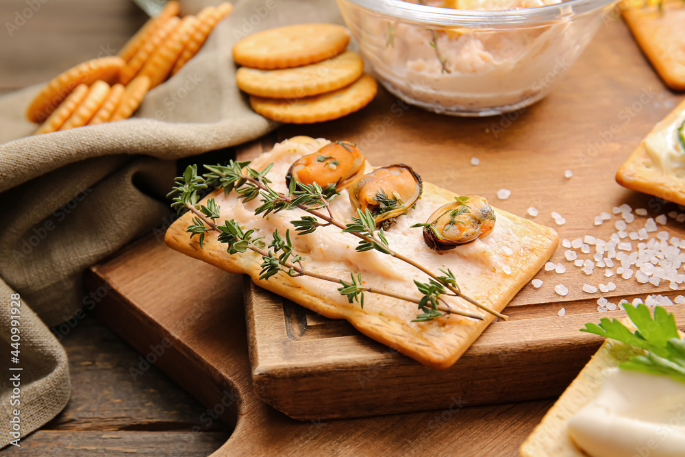 Composition with tasty crackers on wooden background, closeup