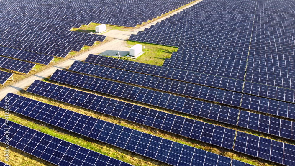 Aerial drone view flight over solar power station panels.