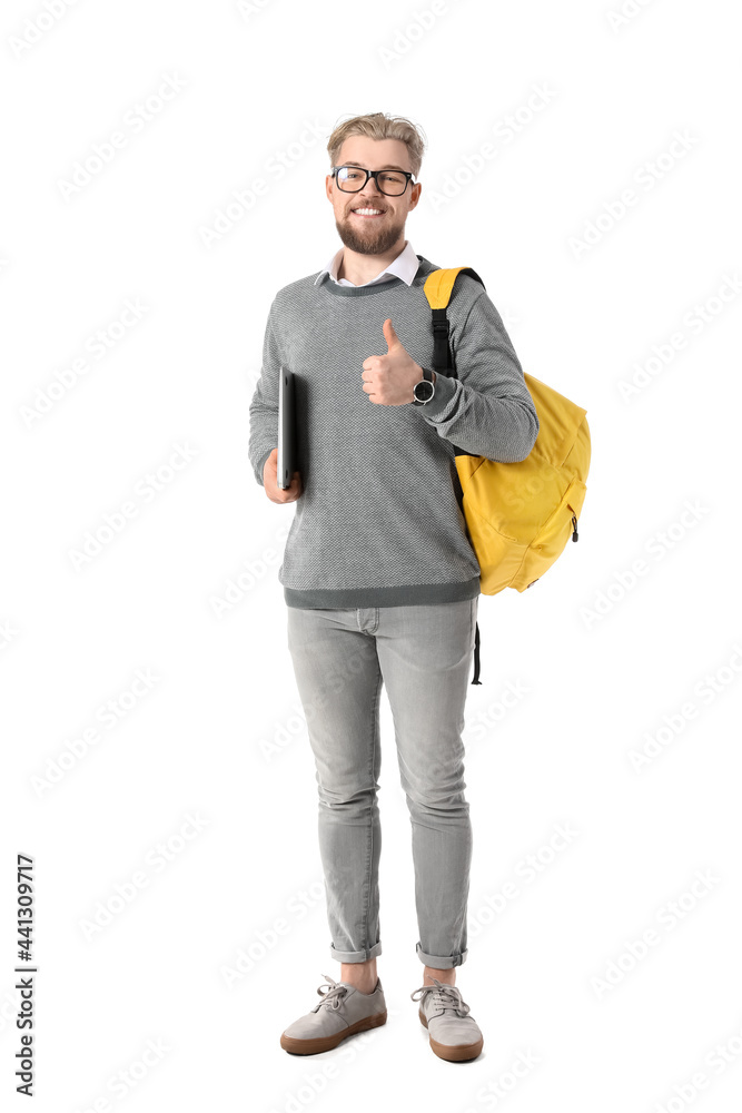 Male student with laptop showing thumb-up on white background