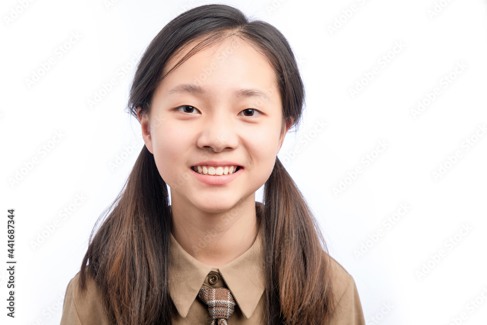 Asian little girl in school uniform on white background