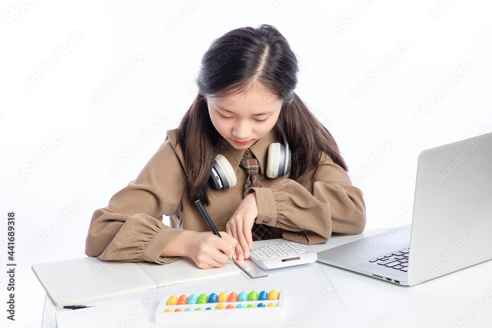 Little Asian girl receiving online education on white background