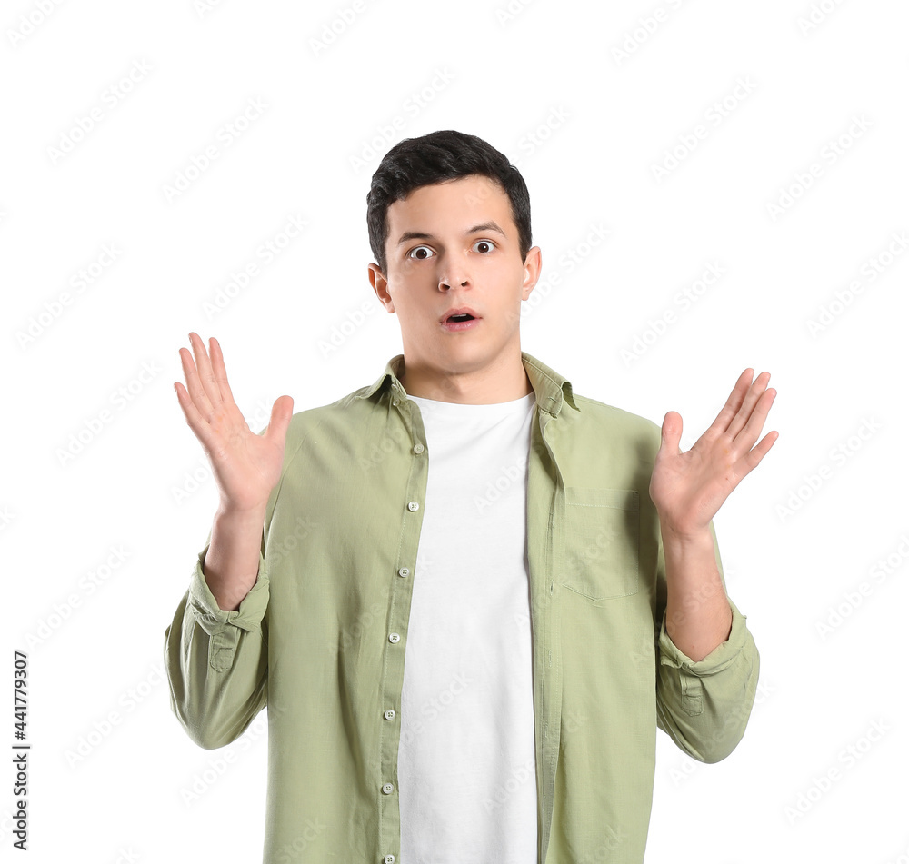 Shocked young man on white background