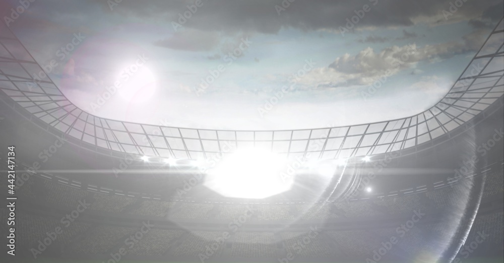 Composition of sports stadium with glowing spotlights and copy space