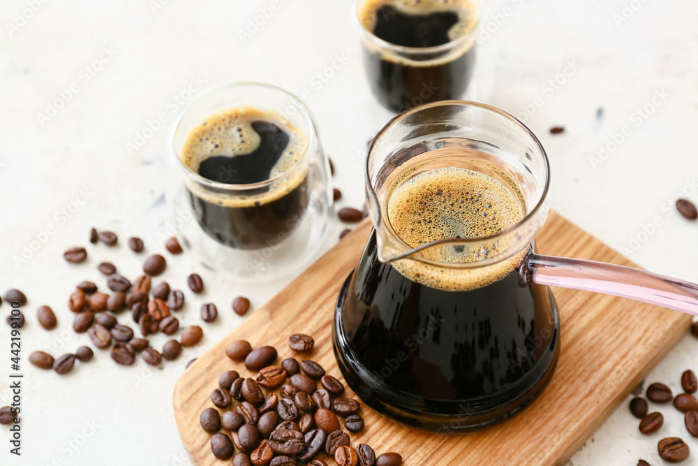 Composition with aromatic turkish coffee and beans on light background, closeup