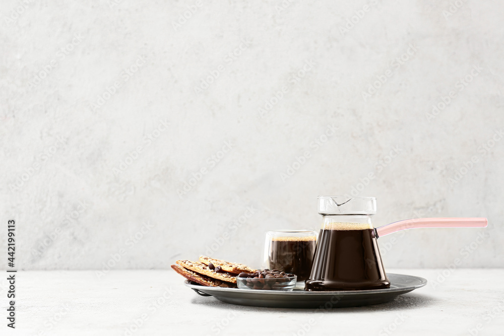 Composition with aromatic turkish coffee, cookies and beans on light background