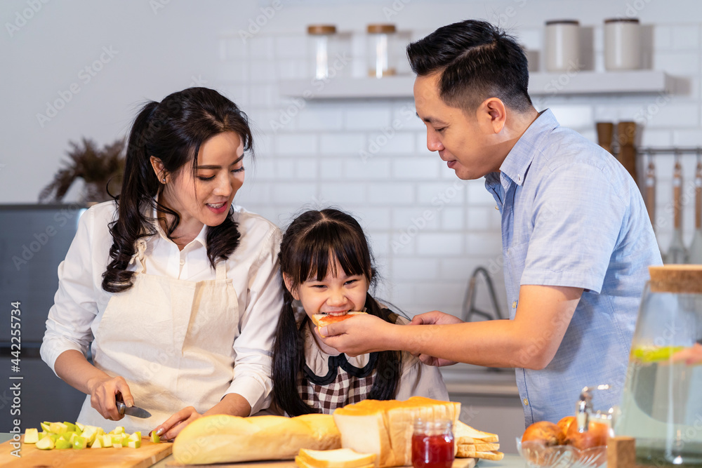 Asian happy family, Mother cook food for dinner in kitchen at house. 