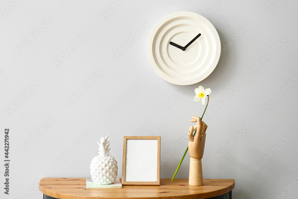 Beautiful narcissus flower with stylish decor on table in room