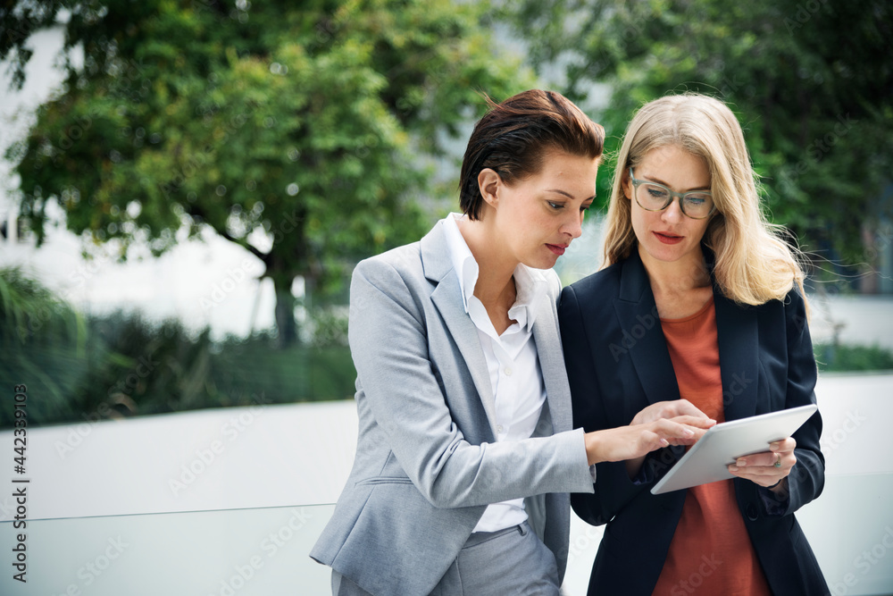 Two businesswomen working together