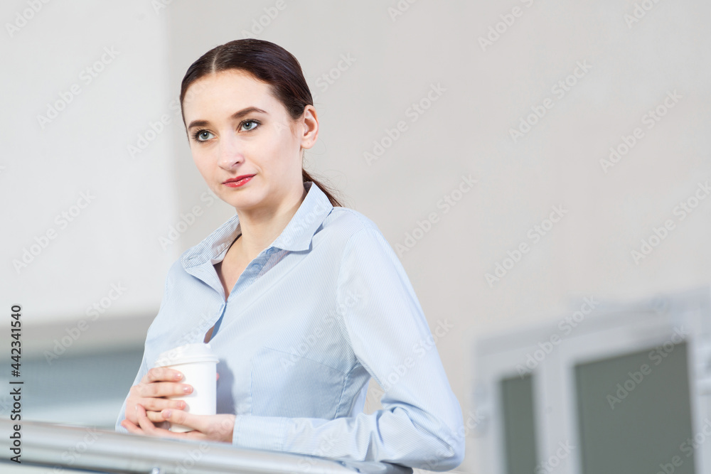 young attractive business woman with a cup of coffee