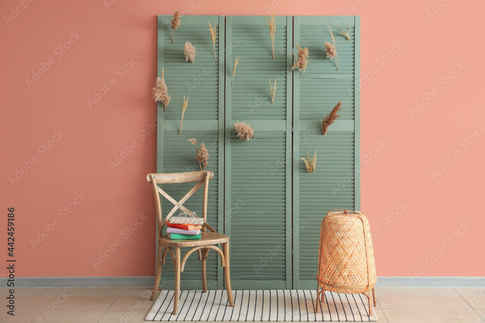 Interior of stylish room with folding screen