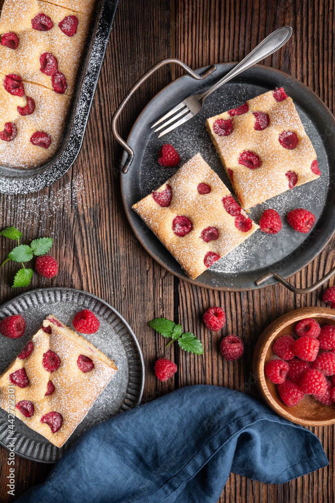 Raspberry cake known as Bublanina sprinkled with powdered sugar