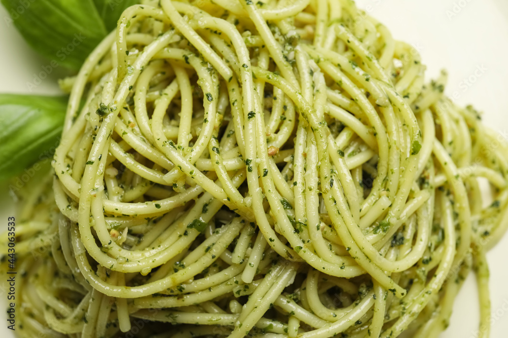 Tasty pasta with pesto sauce, closeup