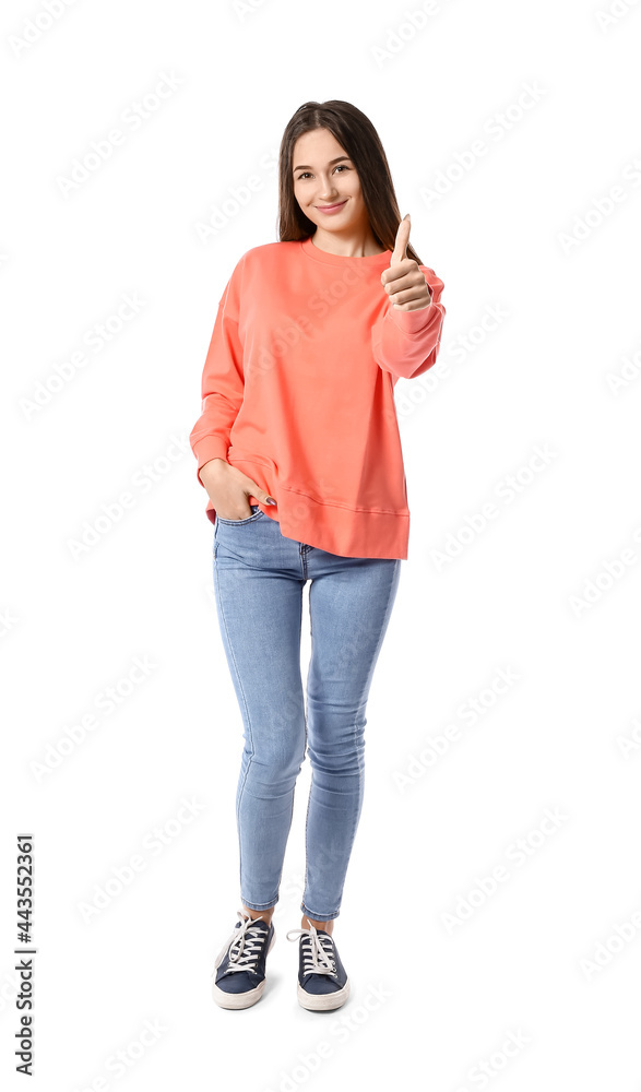 Beautiful young woman showing thumb-up on white background