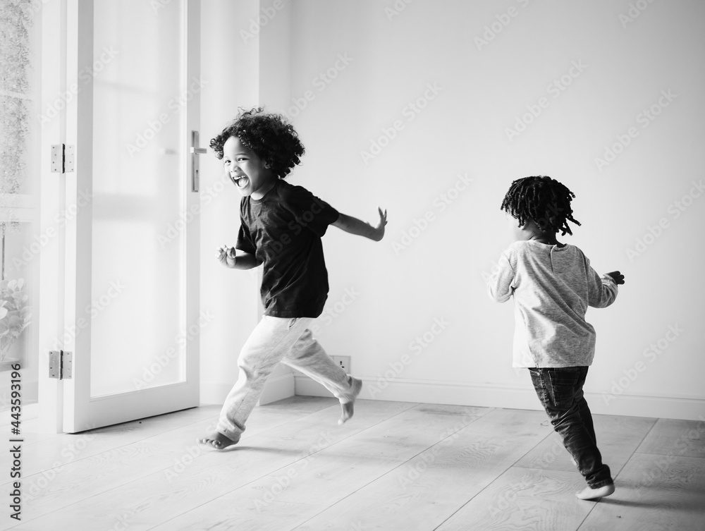 Young African boys playing in their new house