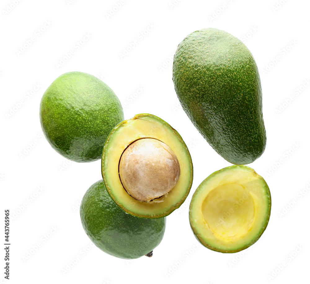 Flying avocados on white background