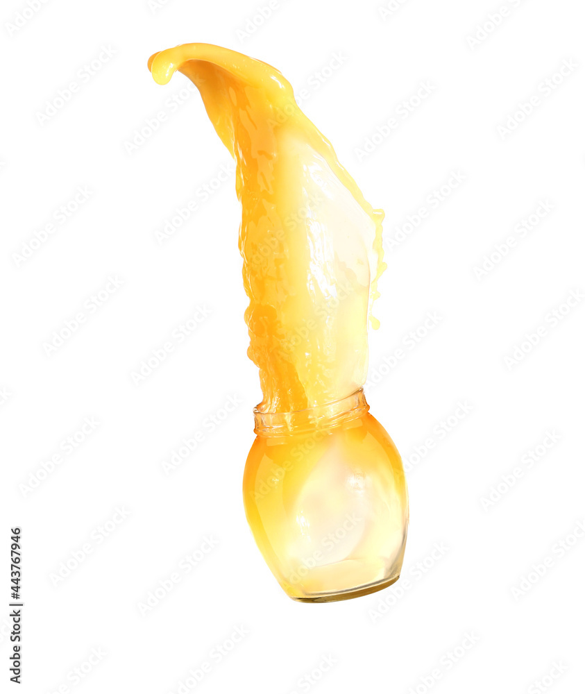 Jar with splash of fresh orange juice on white background