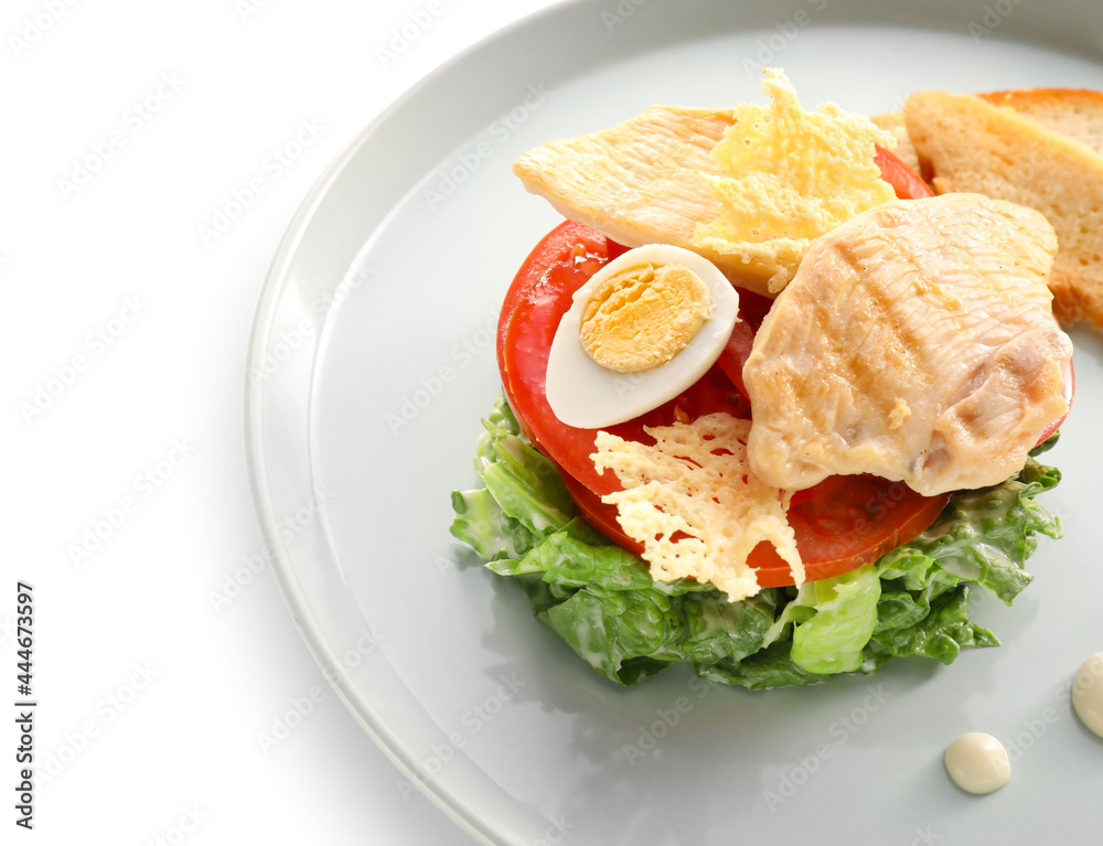 Plate with Caesar salad on white background, closeup