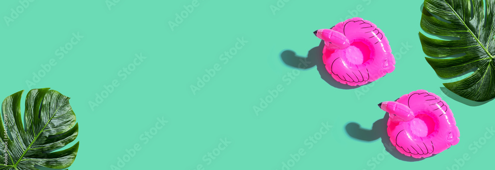 Summer concept with pink flamingo floats