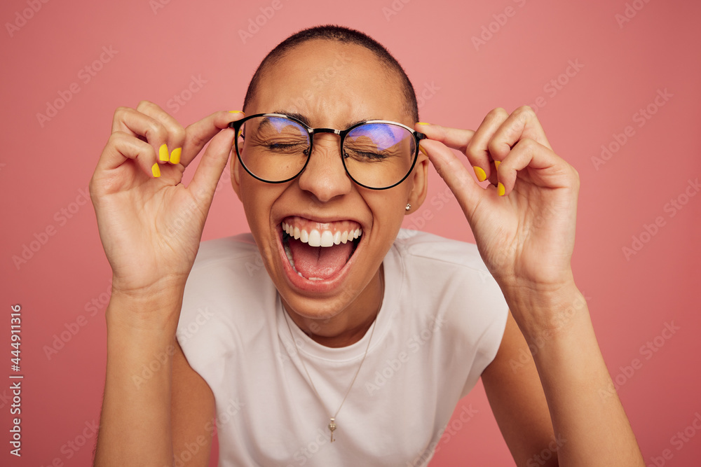 Excited and expressive creative woman wearing eyeglasses