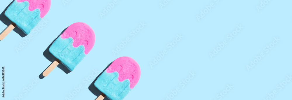 Pink and blue popsicles with shadow