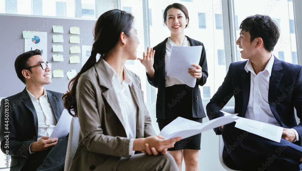 Portrait of Asian businesswoman presenting her plan in a meeting