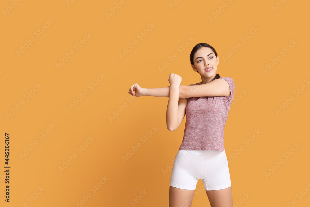 Sporty female coach on color background