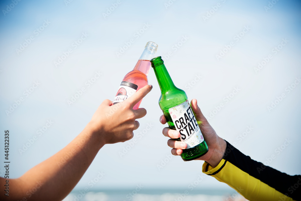 Friends having a drink at the beach