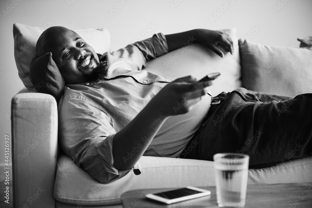 Man lying on the couch after work