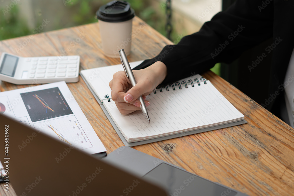 Businessman working in finance and accounting Analyze financial budget in the office