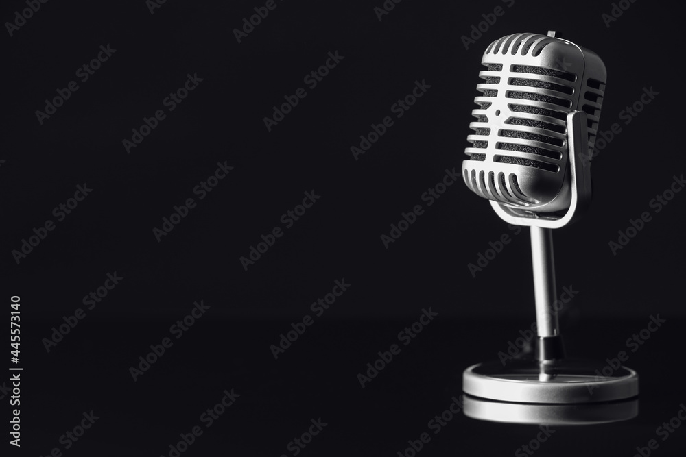 Retro microphone on dark background