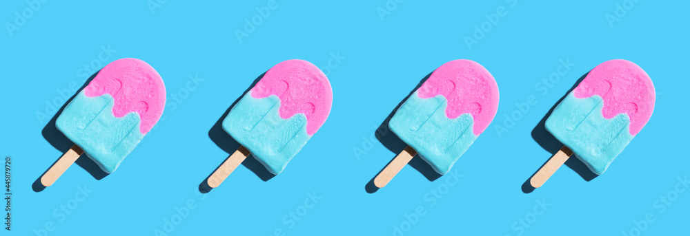 Pink and blue popsicles with shadow