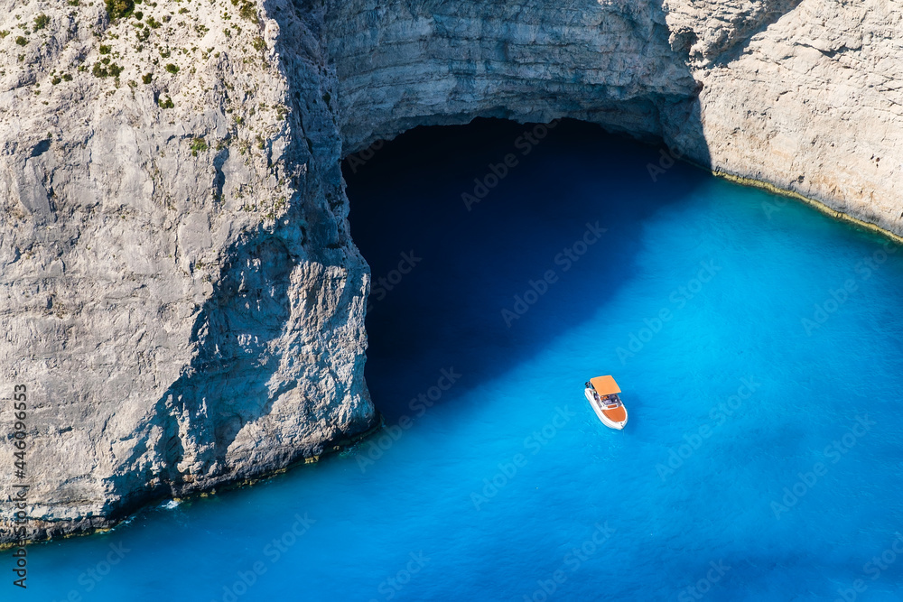 A boat in the lagoon near Navagio Beach, Zakynthos Island, Greece. View of the sea bay and a lone bo