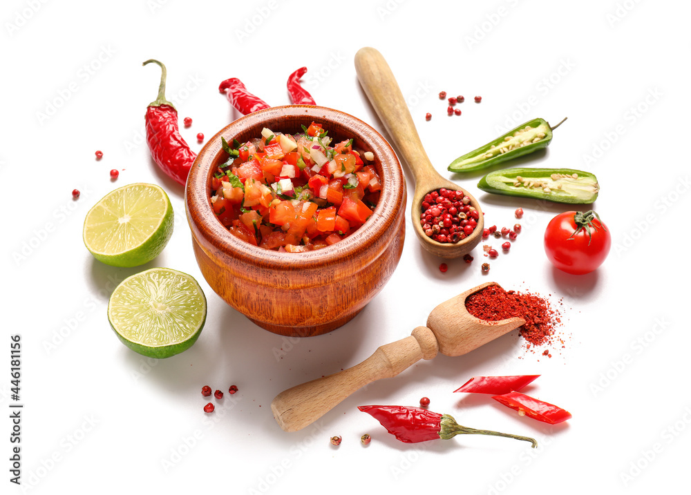 Bowl of tasty salsa sauce and products on white background