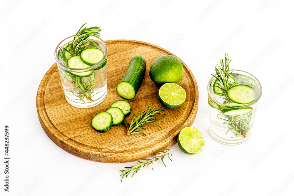 Cold fresh cocktail with lemon slices cucumber and rosemary