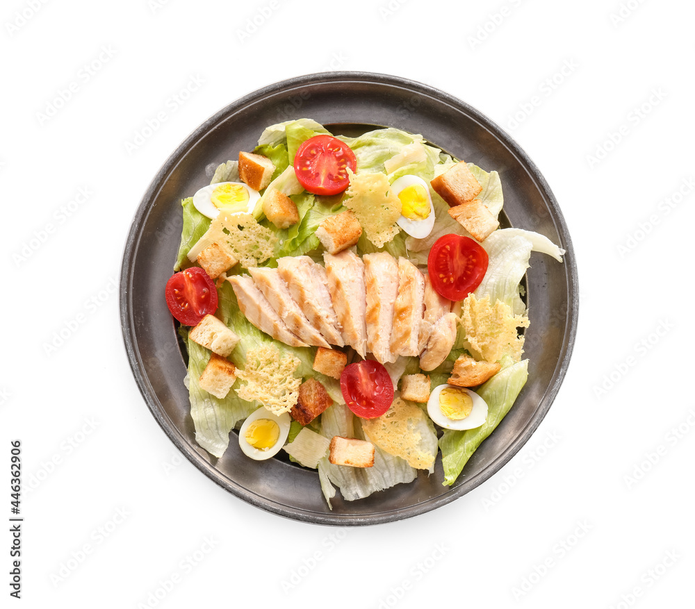 Plate with tasty Caesar salad on white background