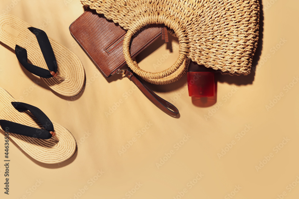 Set of beach accessories on color background