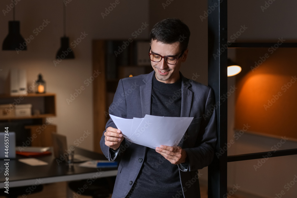 Businessman working in office late at night