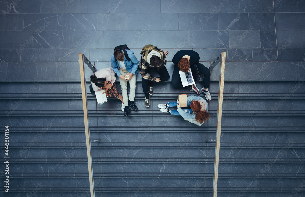 Students sitting in college campus