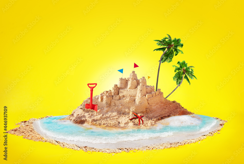 Summer concept sand island and sandcastle on beach