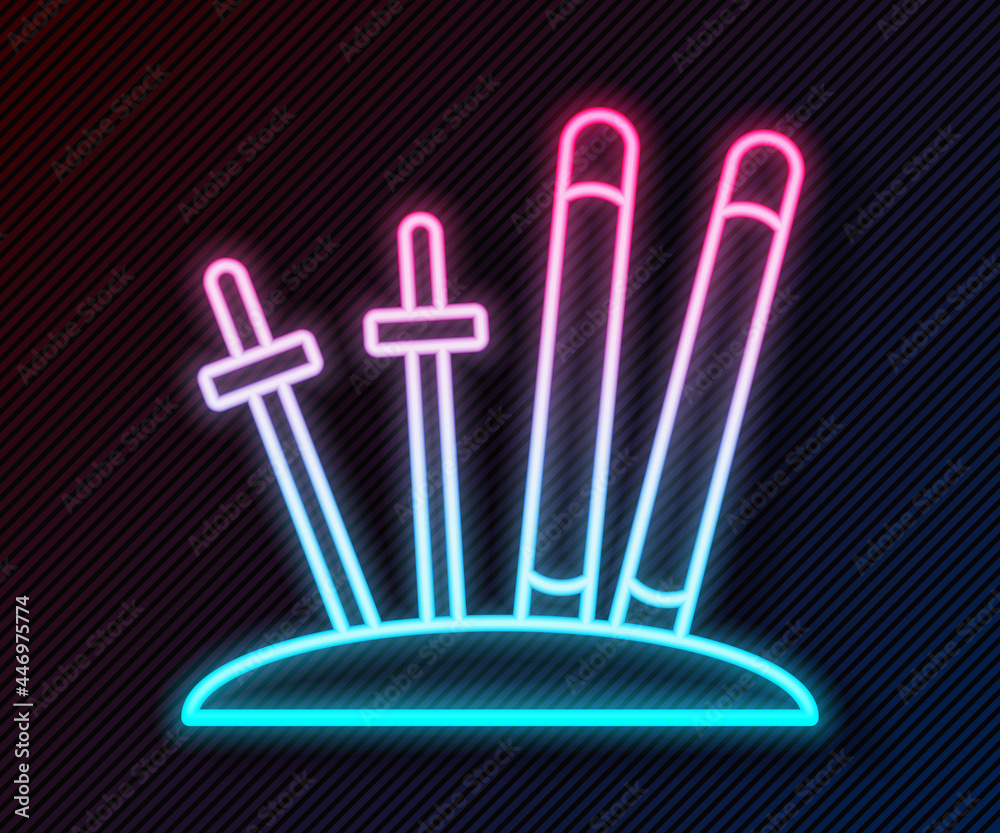 Glowing neon line Ski and sticks icon isolated on black background. Extreme sport. Skiing equipment.